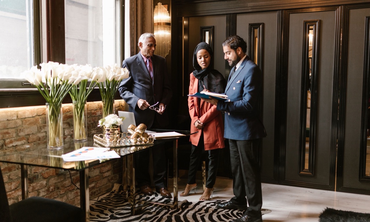 Hotel staff assisting guests in the lobby